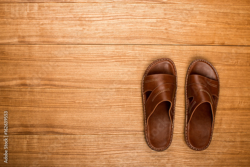 Slippers on a wooden table