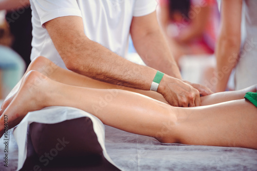 Hands doing foot massage, spa salon