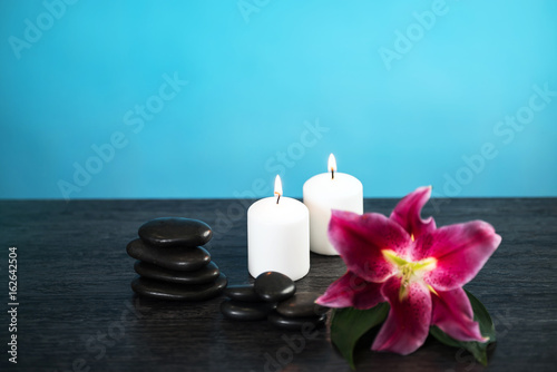 Nature products Spa and wellness setting with flowers  towels  stones and candle