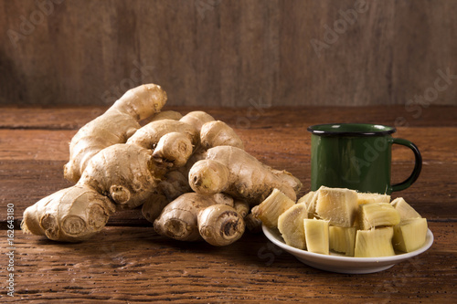 Fresh ginger root on the wooden table