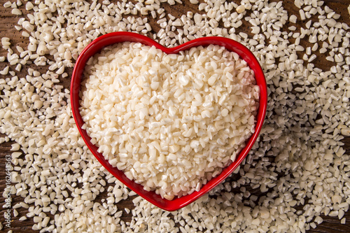 White grated corn kernels in wooden bowl. canjica / mungunza