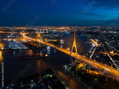 Top view over the highway expressway and motorway at night  Aerial view interchange of a city  Shot from drone Expressway is an important infrastructure in Thailand