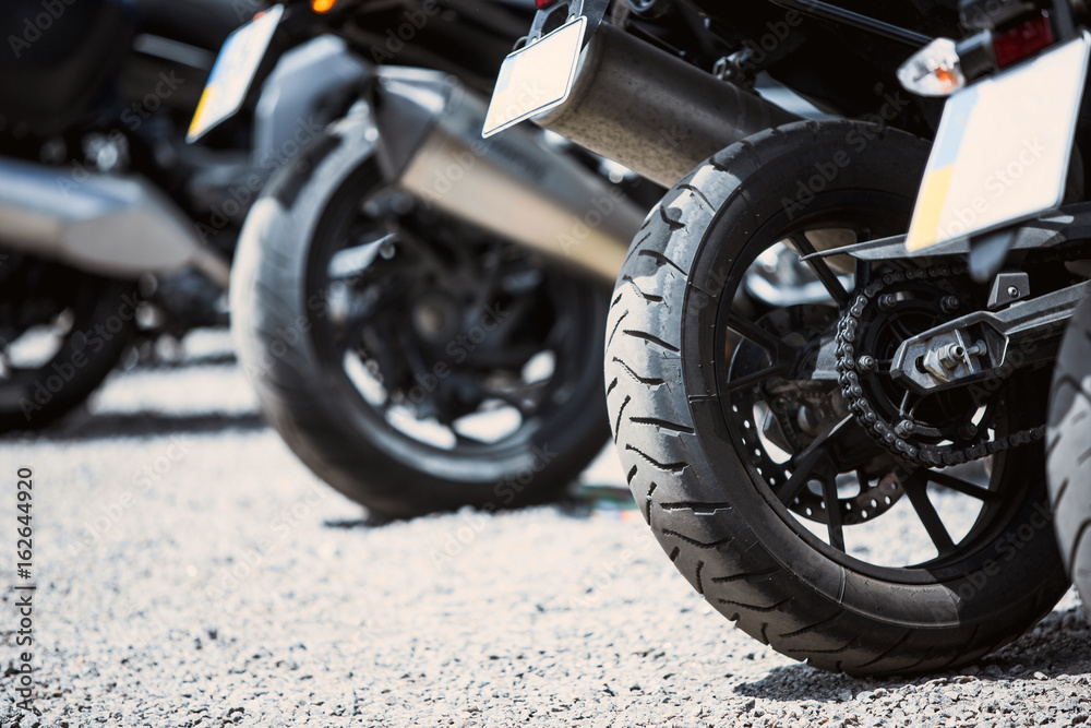 Motorcycle luxury items close-up: headlights, shock absorber, wheel, wing, toning. Motorcycle luxury items close-up: headlights, shock absorber, wheel, wing, toning.