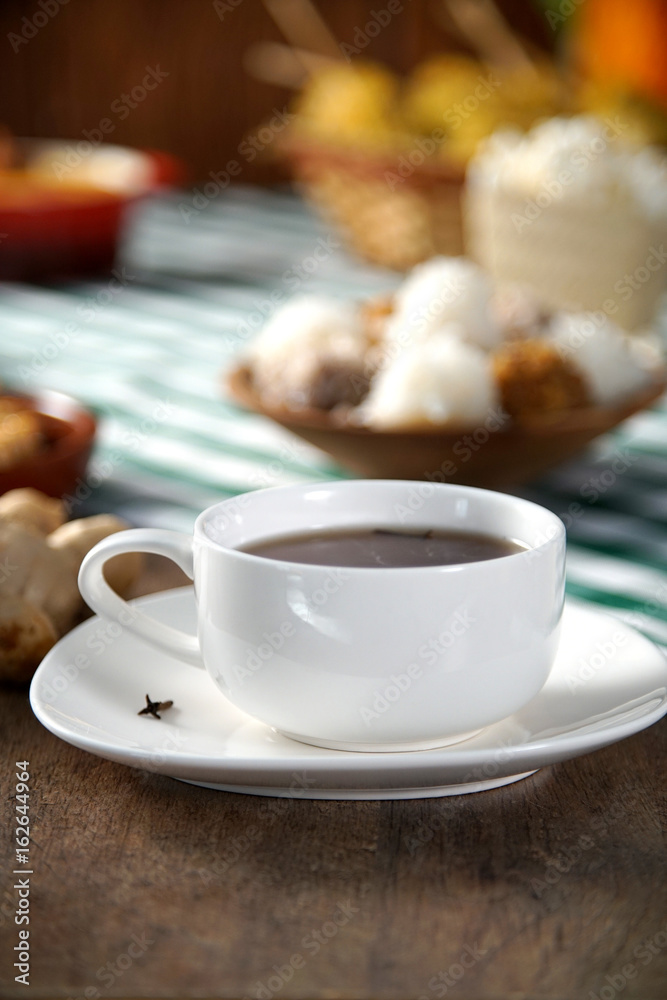 Fototapeta premium Hot chocolate on the Table with some Brazilian delicious. Festa Junina Theme