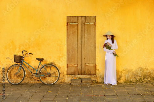 Beautiful  woman with Vietnam culture traditional dress,traditional costume ,vintage style,Vietnam photo