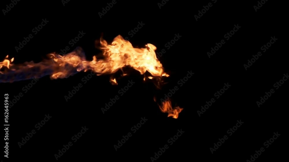 Jet of hot flame sprayed in from left of frame Jet of hot flame sprayed in from left of frame
