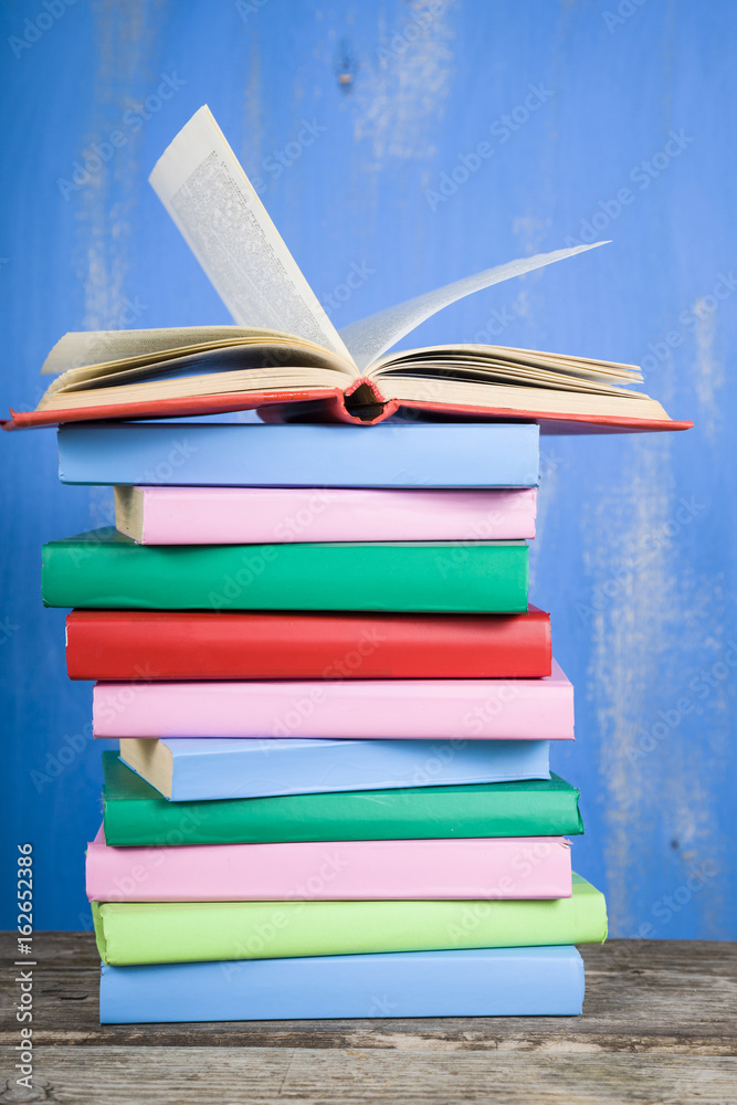 Stack of books on a blue background. Stack of books on a blue background.