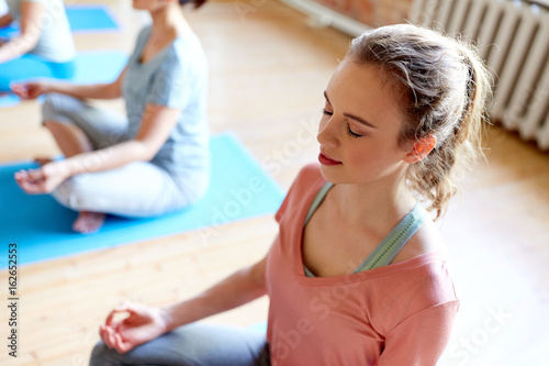 woman meditating at yoga studio
