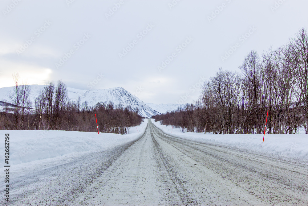 Obraz premium freeze road to tromso cover with snow in winter 