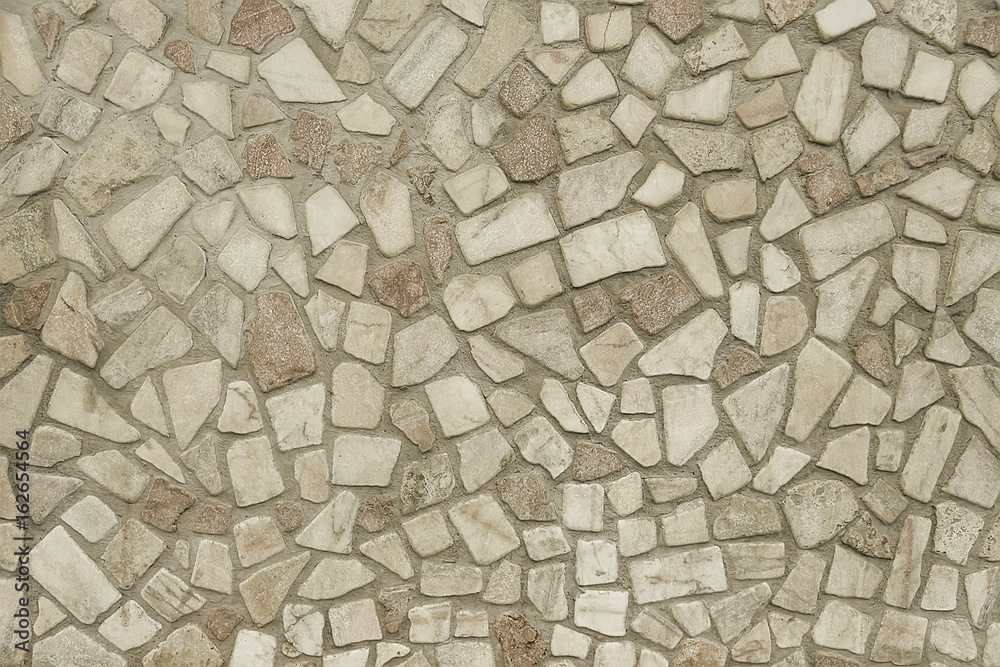 Old beige mosaic wall background texture