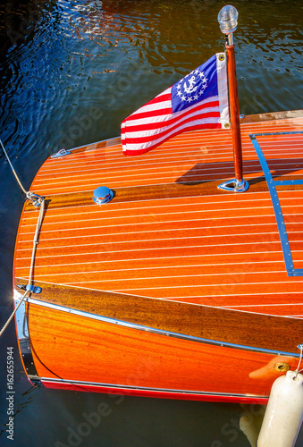 Barrel Back Mahogany Runabout and Ensign - Starboard Qtr