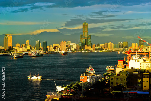 Kaohsiung Harbor at sunset with ferries  cargo ships passing through in Kaohsiung  Taiwan.