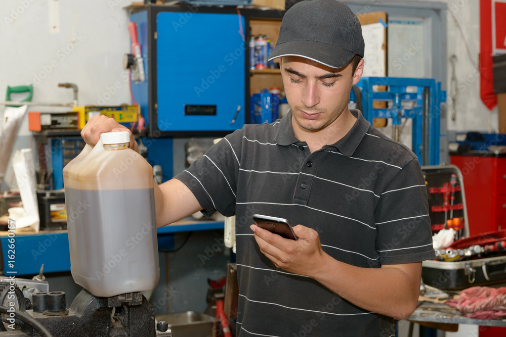 Portrait of a young mechanic in his workshop Portrait of a young mechanic in his workshop