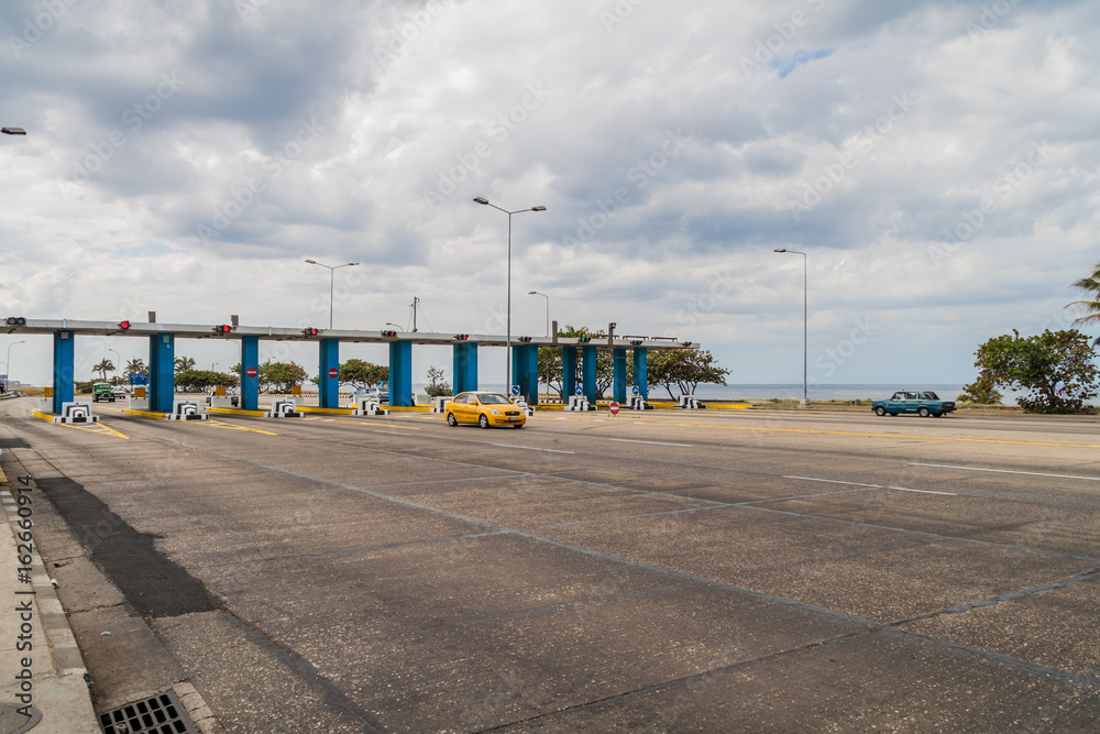 HAVANA, CUBA - FEB 22, 2016: Toll booth at the entry to Havana tunnel. HAVANA, CUBA - FEB 22, 2016: Toll booth at the entry to Havana tunnel.