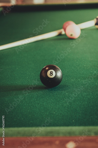 Snooker ball and stick on billiard table