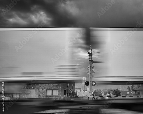 Two moving train cars and crossing signal- Flagstaff, Arizona