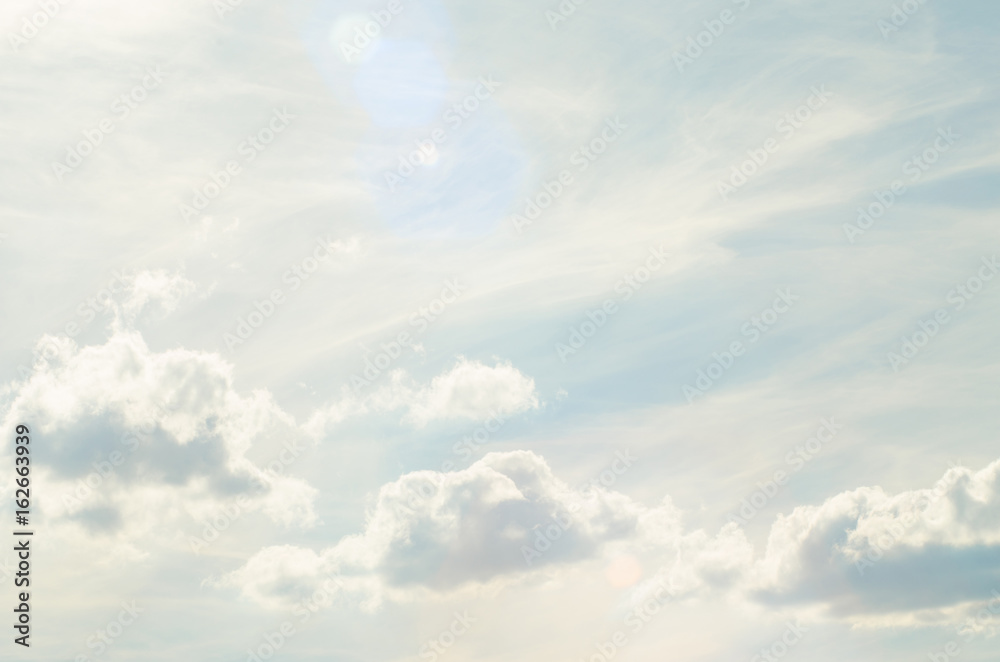 Beautiful sky with clouds, free space for your text. Background with clouds and sunlight.