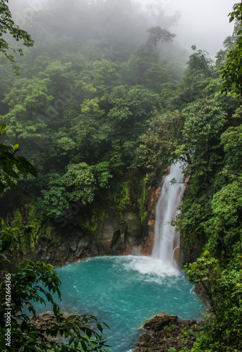 Rio Celeste waterfall in the fog