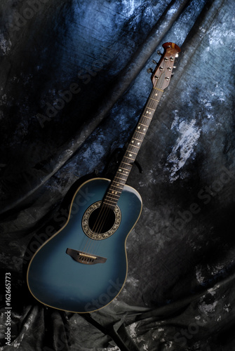 blue guitar on satnd  photo