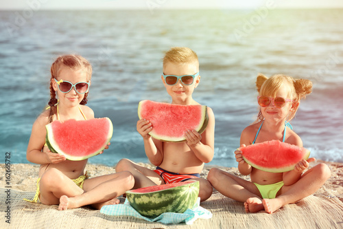 Cute kids eating watermelon...