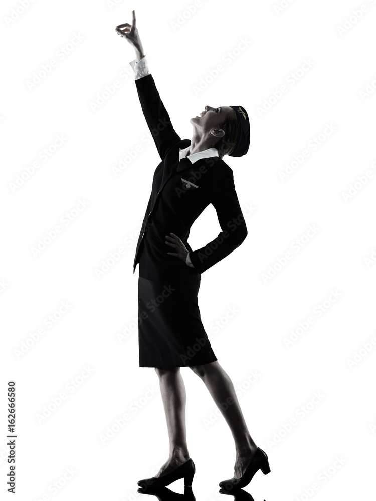one caucasian Stewardess cabin crew woman pointing showing isolated on white background in silhouette one caucasian Stewardess cabin crew woman pointing showing isolated on white background in silhouette