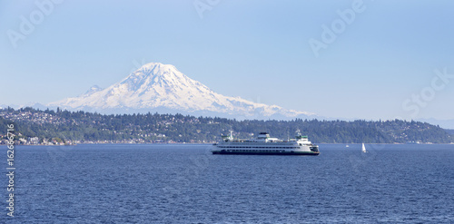 Passenger ferry boat sailing in Puget Sound with Mt Rainier in background