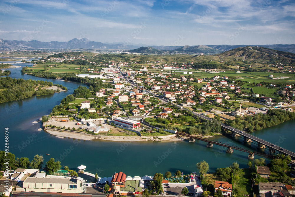 Albania Shkoder city seen from the top of the mountain. Beautiful landscape with river during sunny summer day.