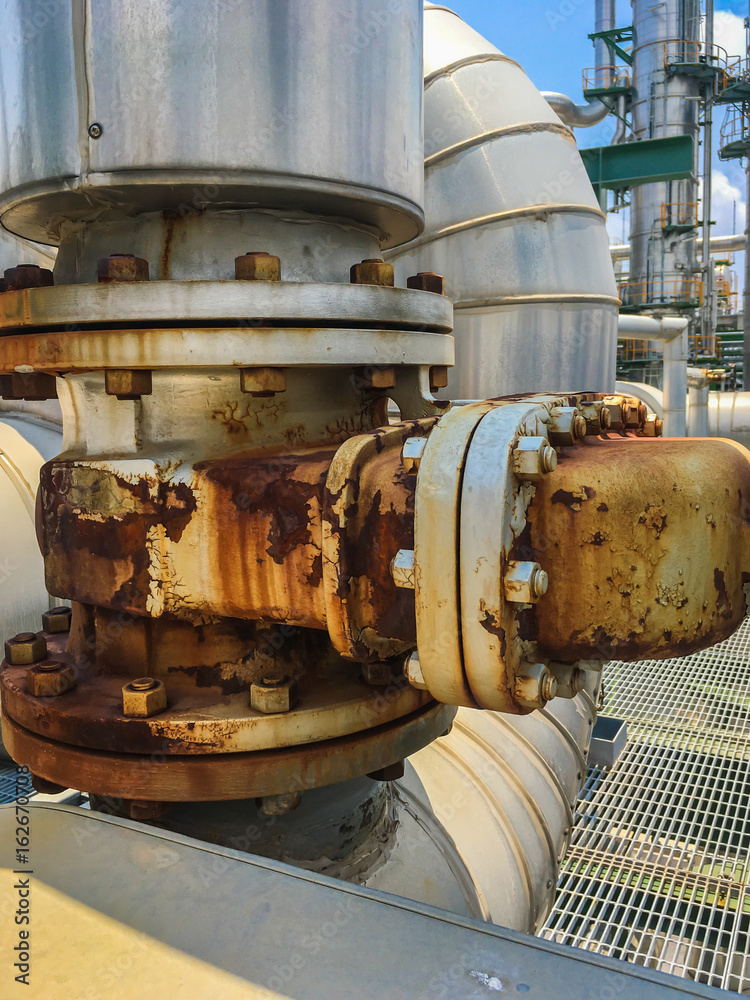 The equipment of oil refining in process area ,Close up of industrial pipelines of an oil refinery plant