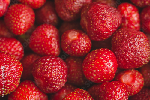 background from freshly harvested strawberries, full frame.