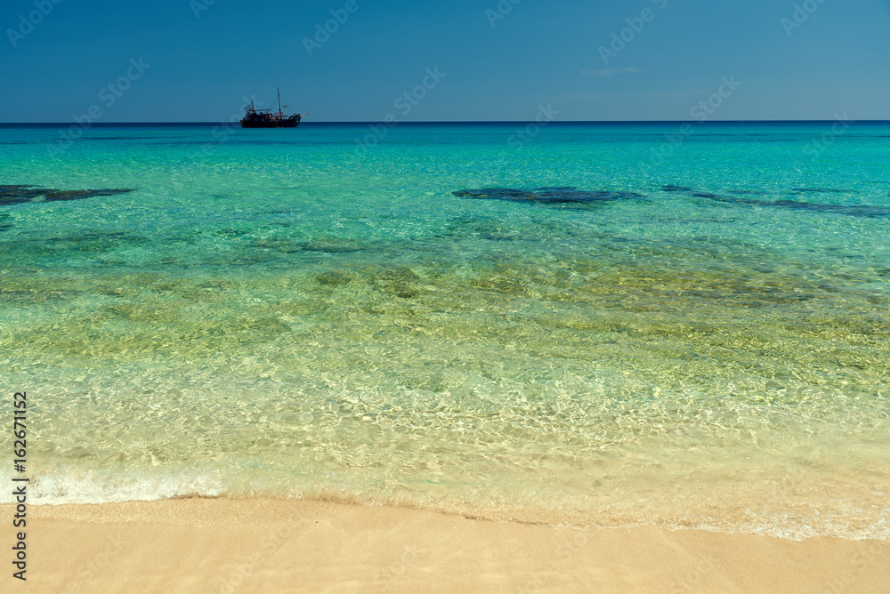 Beach with transparent water.