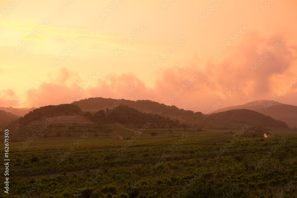 orange dramatic sunset over hills
