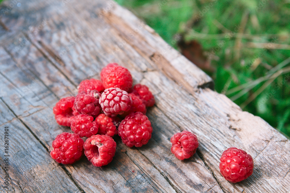 Raspberries on a wooden surface