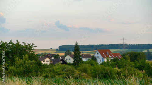Beautiful sunset over a field and a small town in Germany.