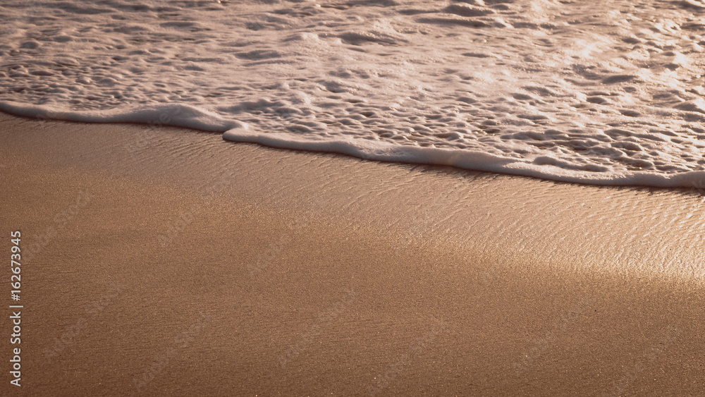 Gentle Wave Rolling over Sandbeach in Sunset light, Beautiful Crystal Bay, Nusa Penida Bali Gentle Wave Rolling over Sandbeach in Sunset light, Beautiful Crystal Bay, Nusa Penida Bali