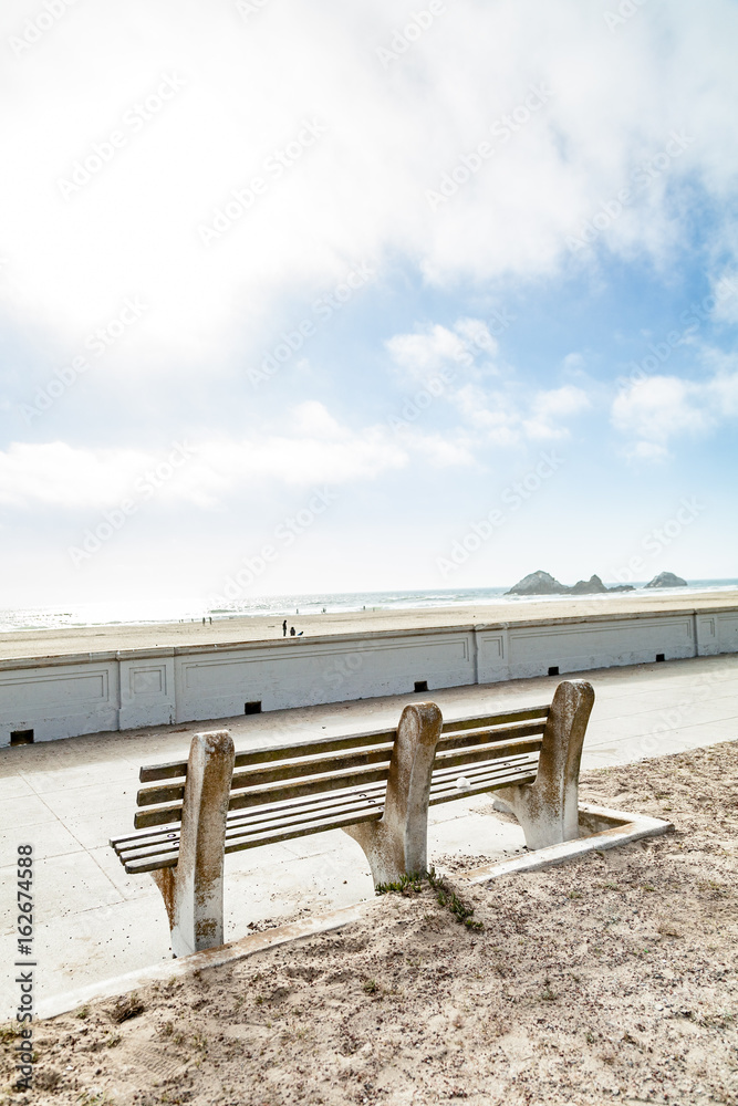 stone bench overlooking beach