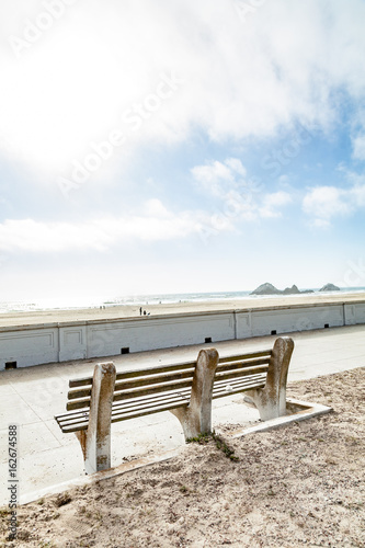 stone bench overlooking beach © PETE