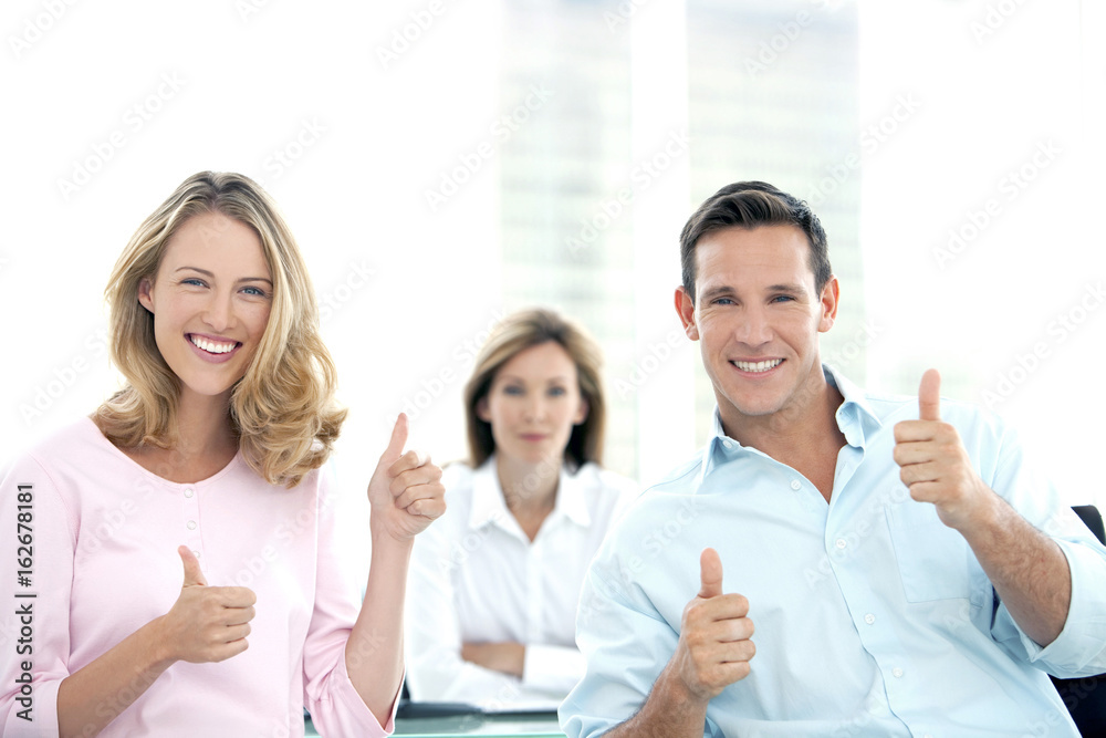 Happy Young couple with Financial adviser at the bank Happy Young couple with Financial adviser at the bank