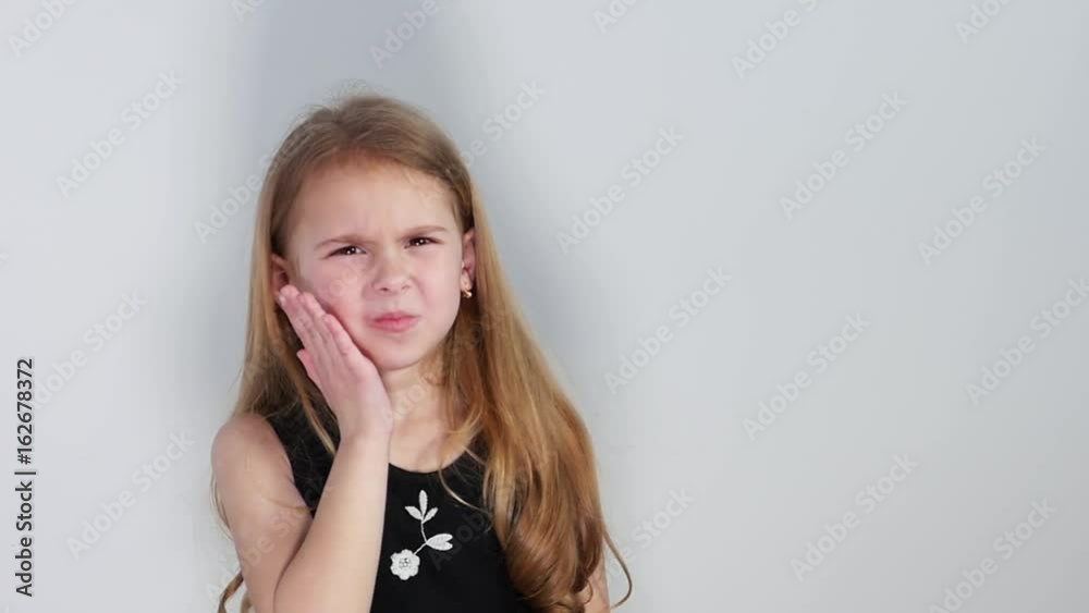 Teen girl suffers from a toothache. Slow motion Teen girl suffers from a toothache. Slow motion