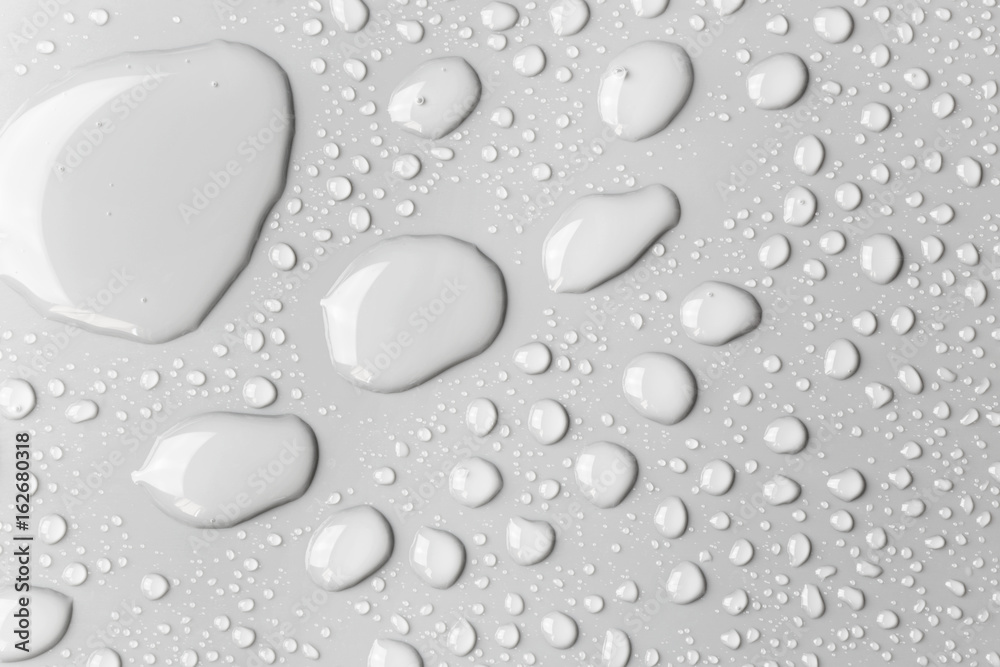 Raindrops on a grey surface, background Raindrops on a grey surface, background