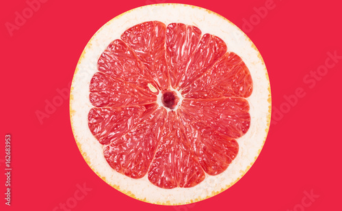 Grapefruit isolated on red background