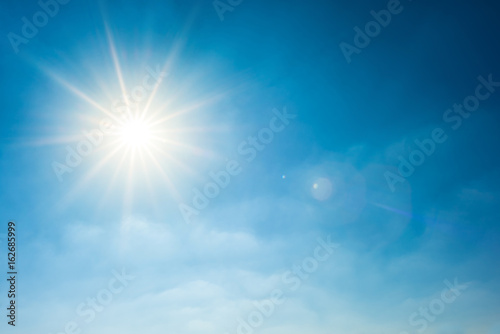 Sunny background, wonderful blue sky with bright sun © Günter Albers