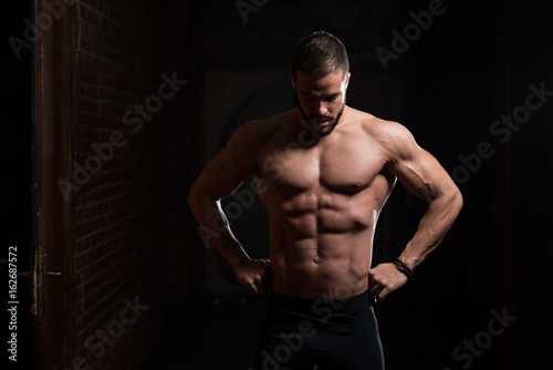 Handsome Model Flexing Muscles