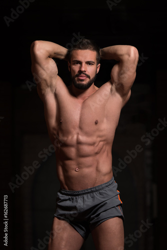 Handsome Model Flexing Muscles