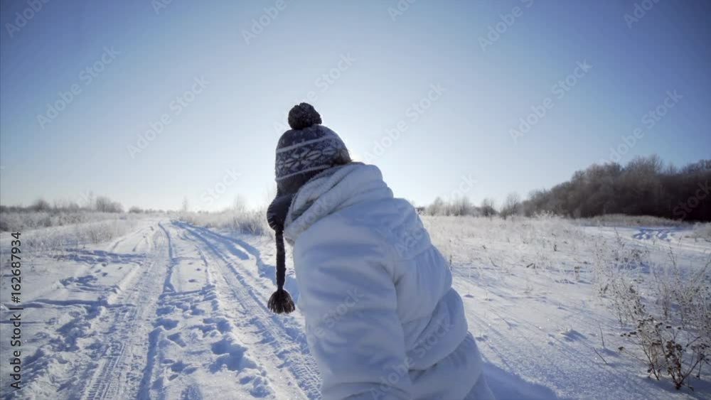 couple play in snow poi