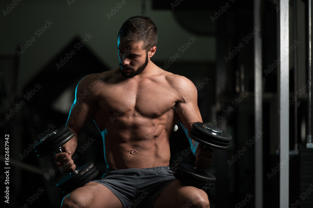 Attractive Young Model Resting In Gym Afther Exercise