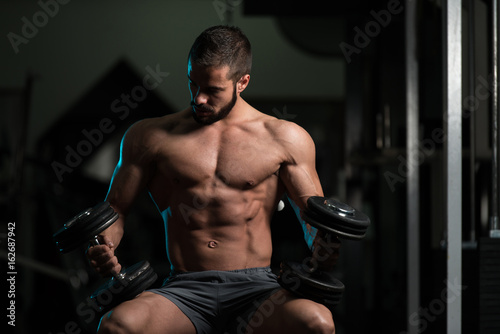 Attractive Young Model Resting In Gym Afther Exercise