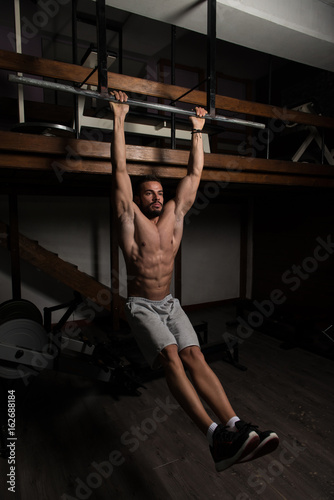 Athlete Performing Hanging Leg Raises Exercise Ab Exercises