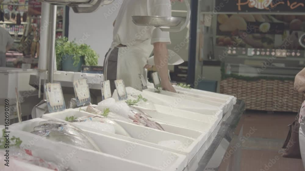 Fishmonger preparing fish