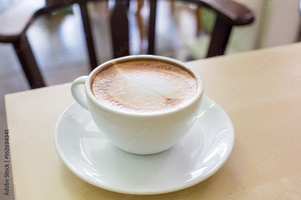 Obraz premium coffe latte cup on a wood table