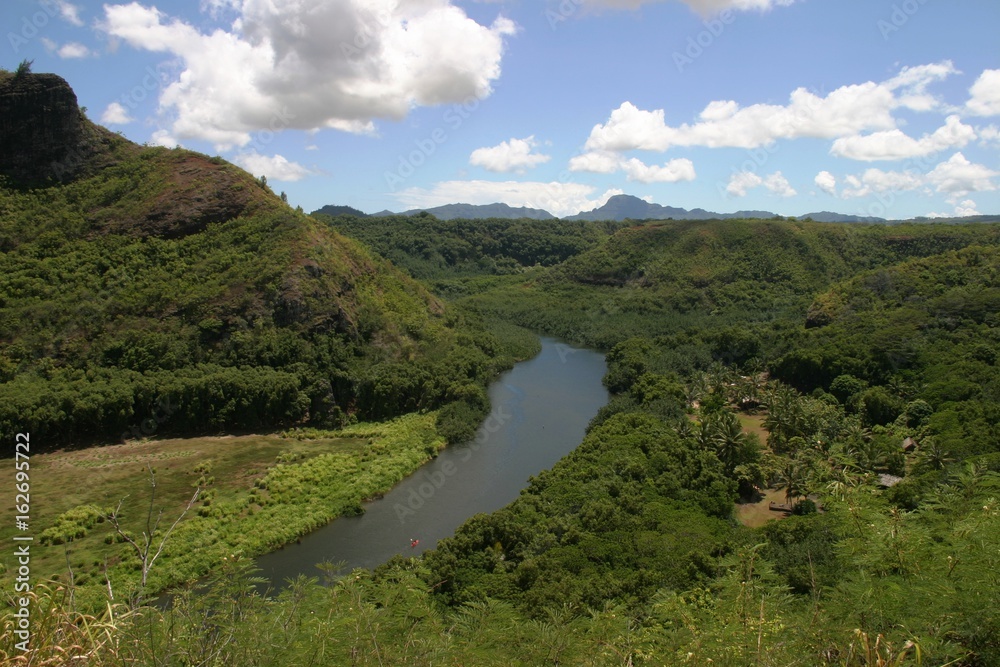 The 20-mile long Wailua River on Kauai, Hawaii is one of the most navigable rivers boasting of lush jungle landscape.